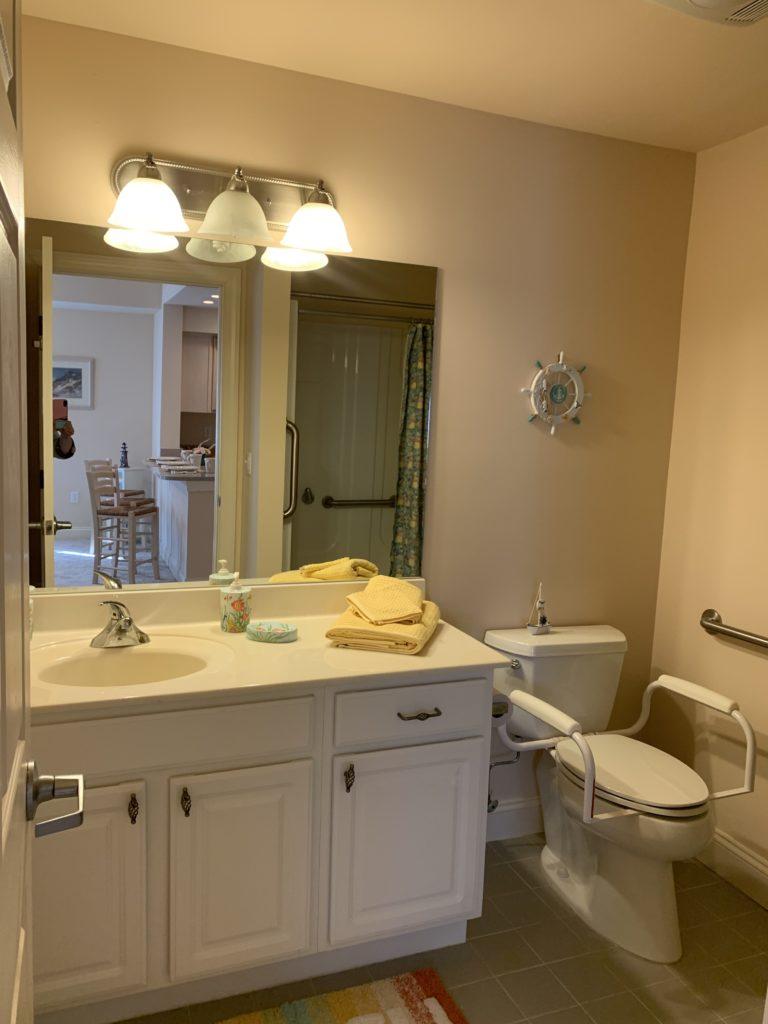 unit bathroom with fine fixtures and accesible toilet